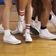 Group of dancers' legs with converse sneakers on
