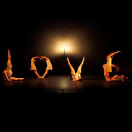 Dancers using their bodies to form the word LOVE